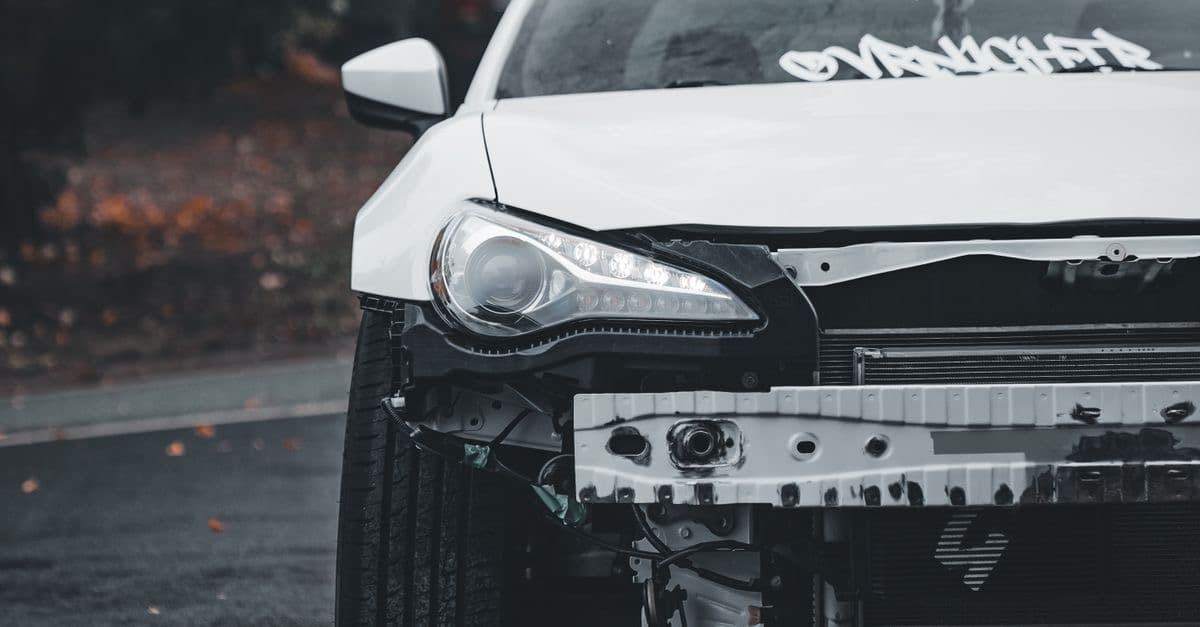 Vehicle with visible front-end damage after a collision